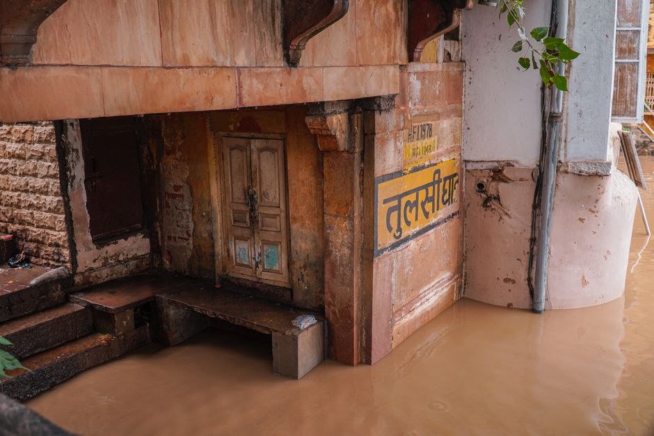 Flooded basement stairwell showing standing water